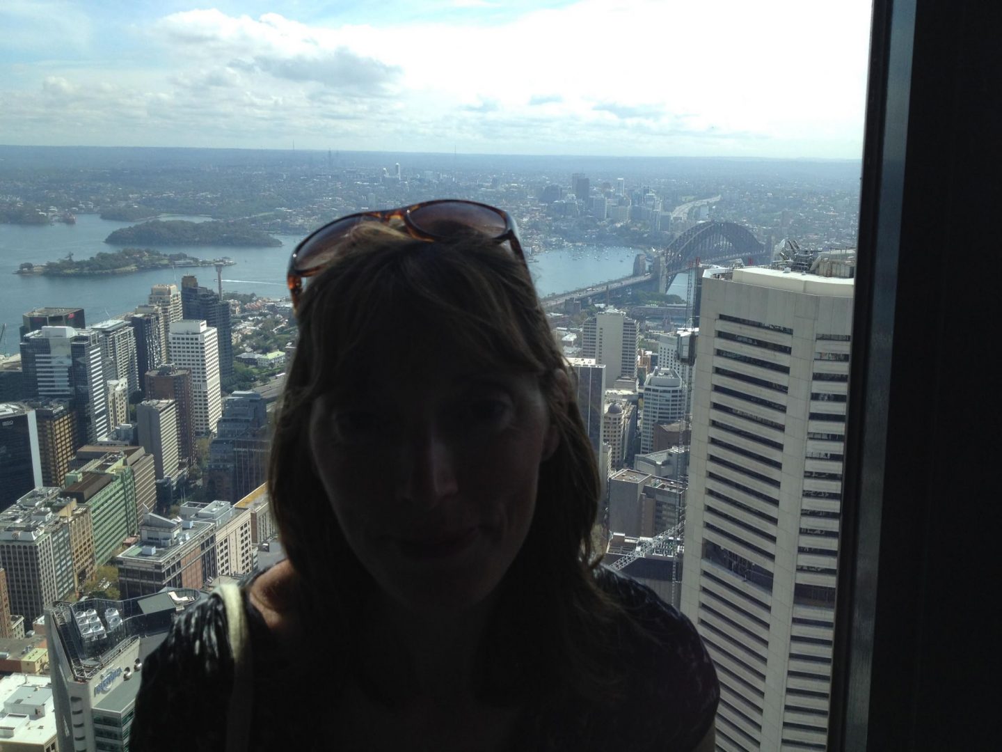 Mum in front of the view from the Sydney Tower Eye, Australia