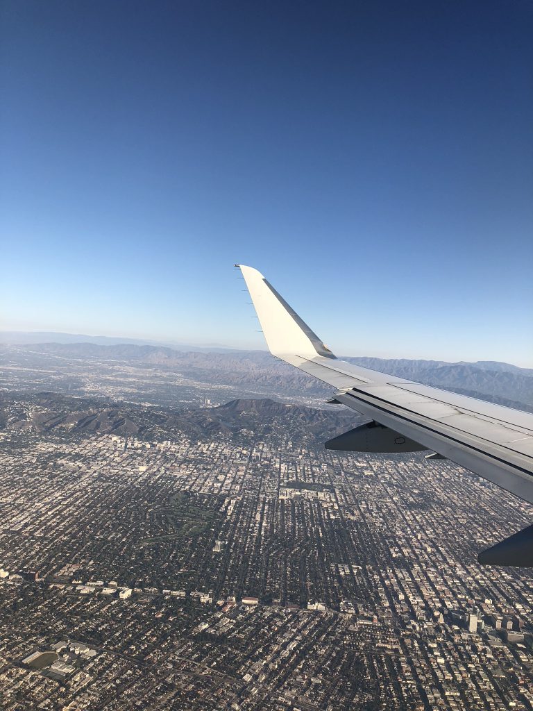 Flying over Hollywood hills and sign in California