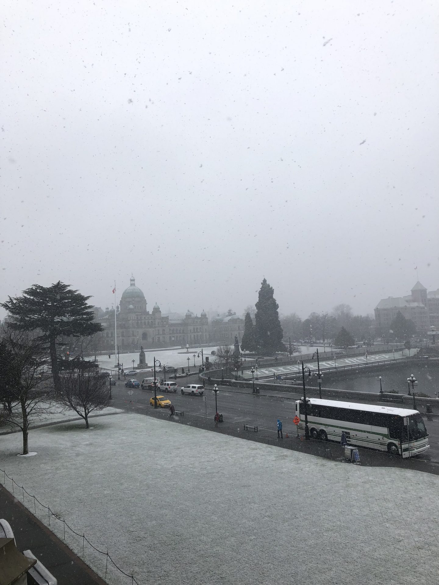Snow falling over Victoria, British Columbia and the Parliament Building