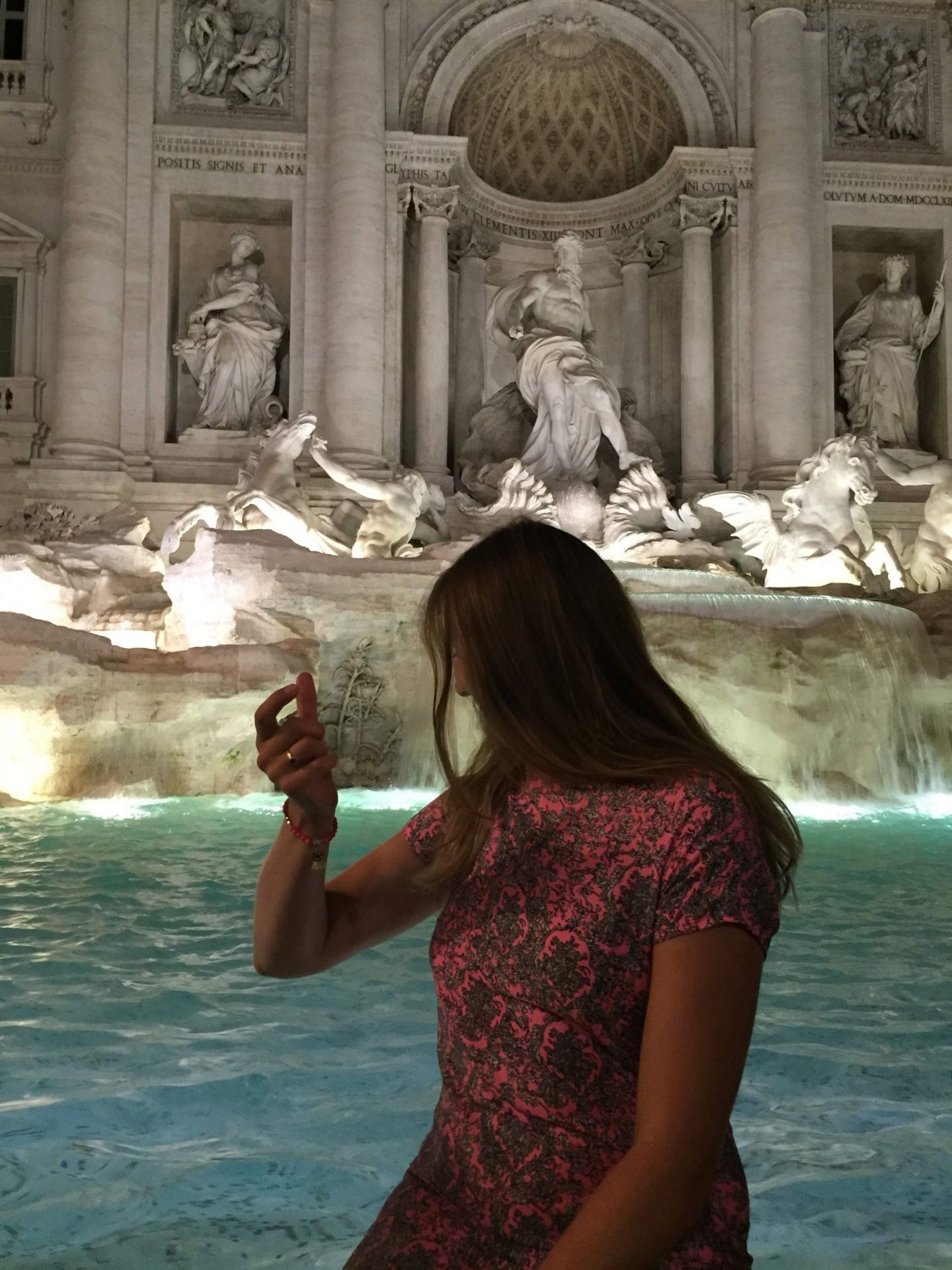 Throwing the coin in the Trevi Fountain, Rome