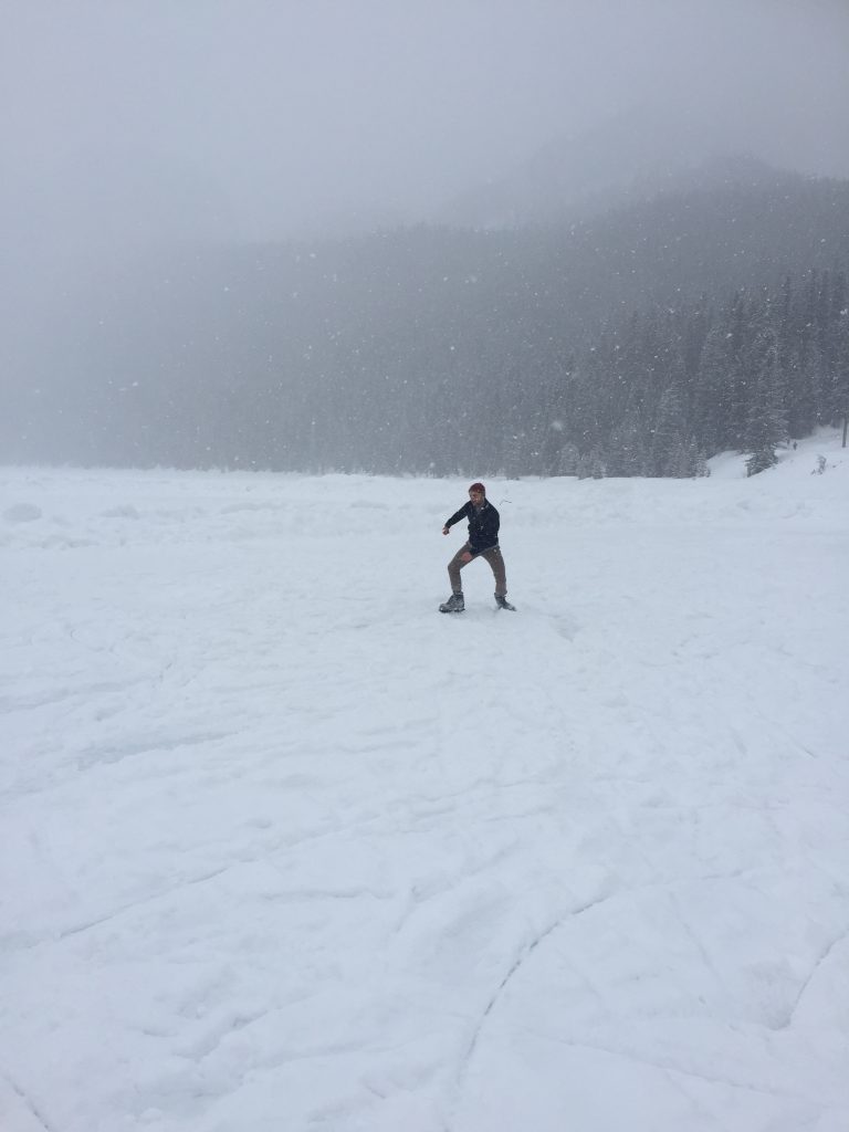 Ice skating tricks across Lake Louise