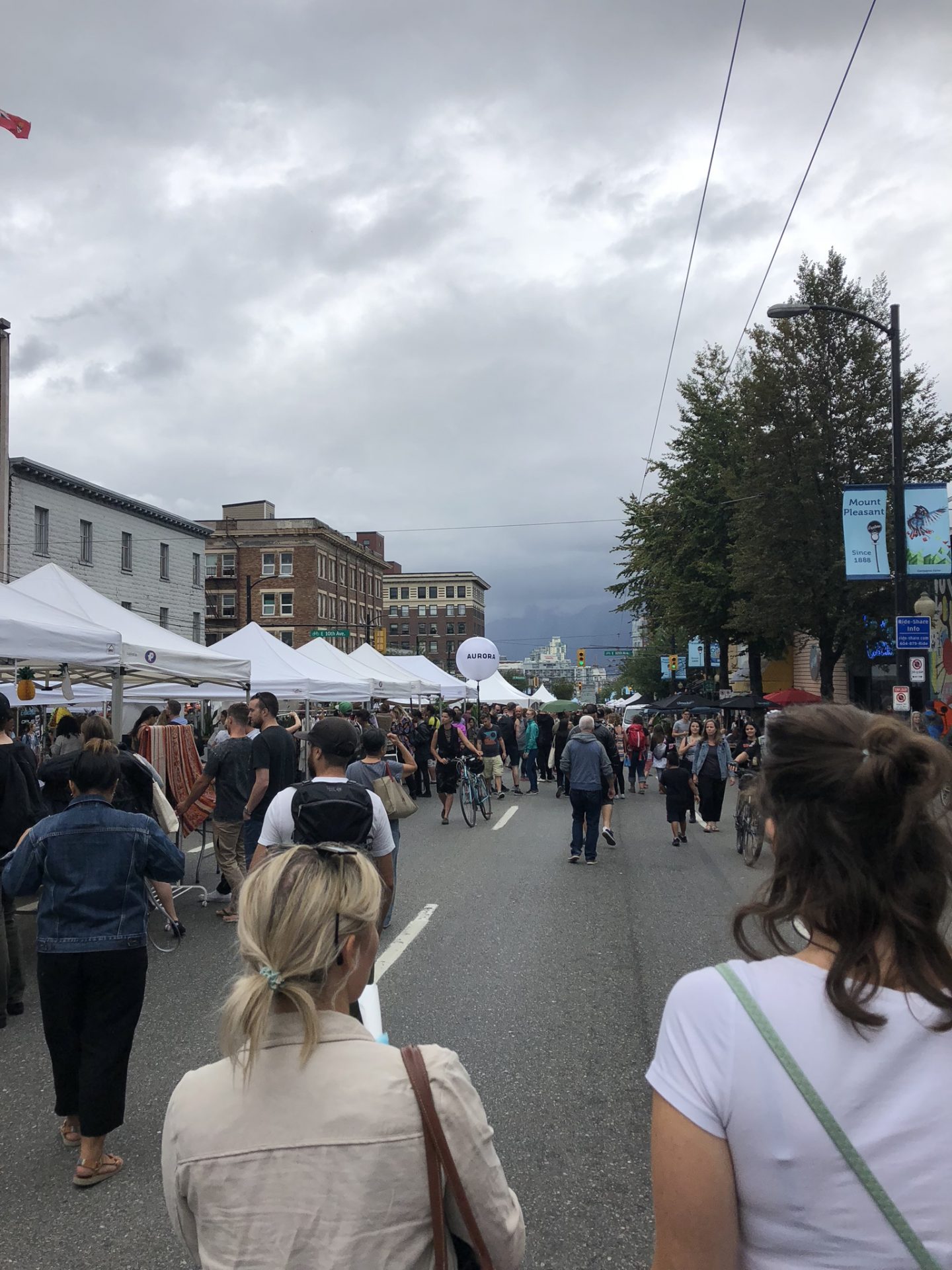 Walking along Main Street for Vancouver Mural Festival