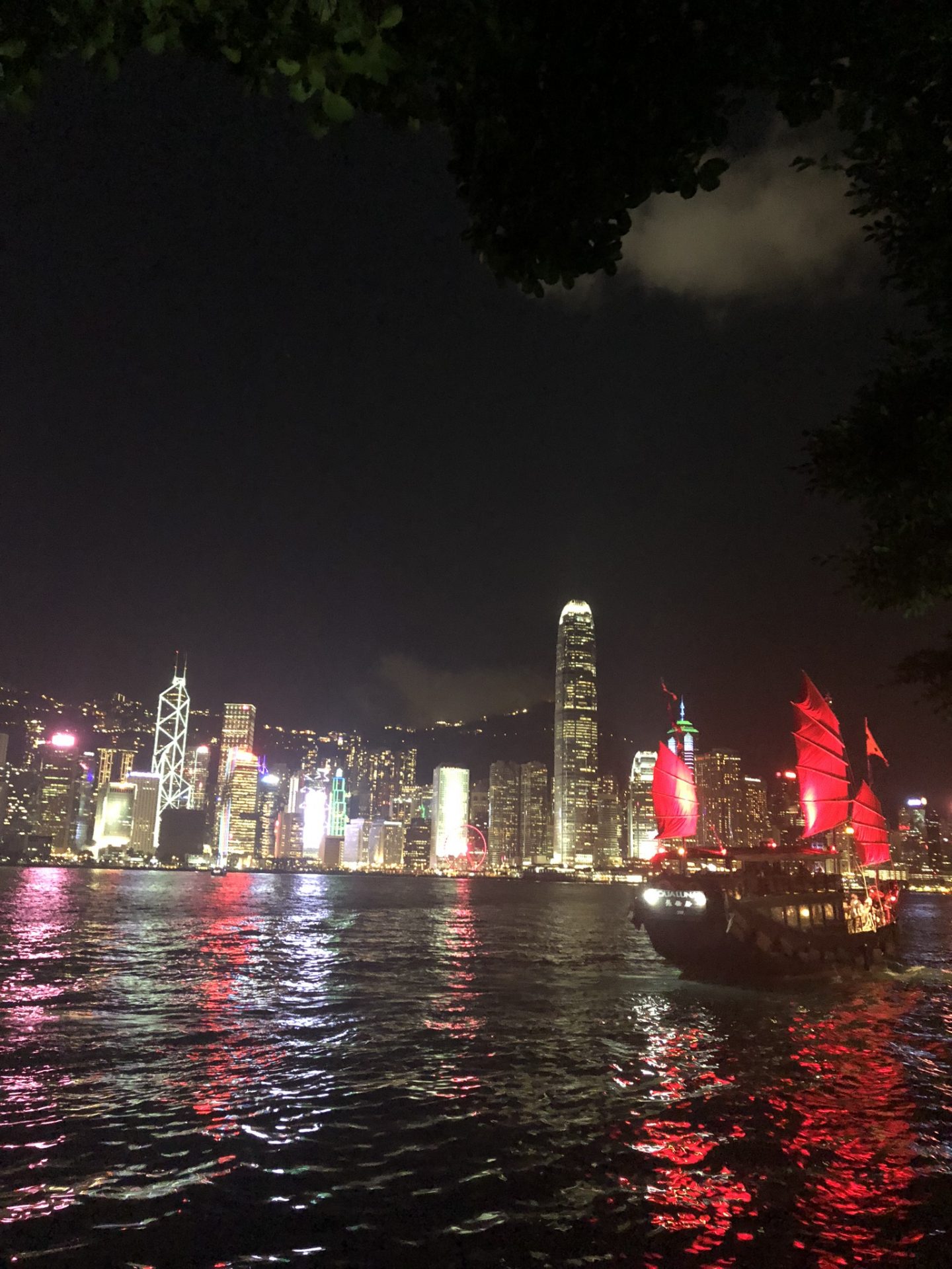 Sailboat on Victoria Harbour at night